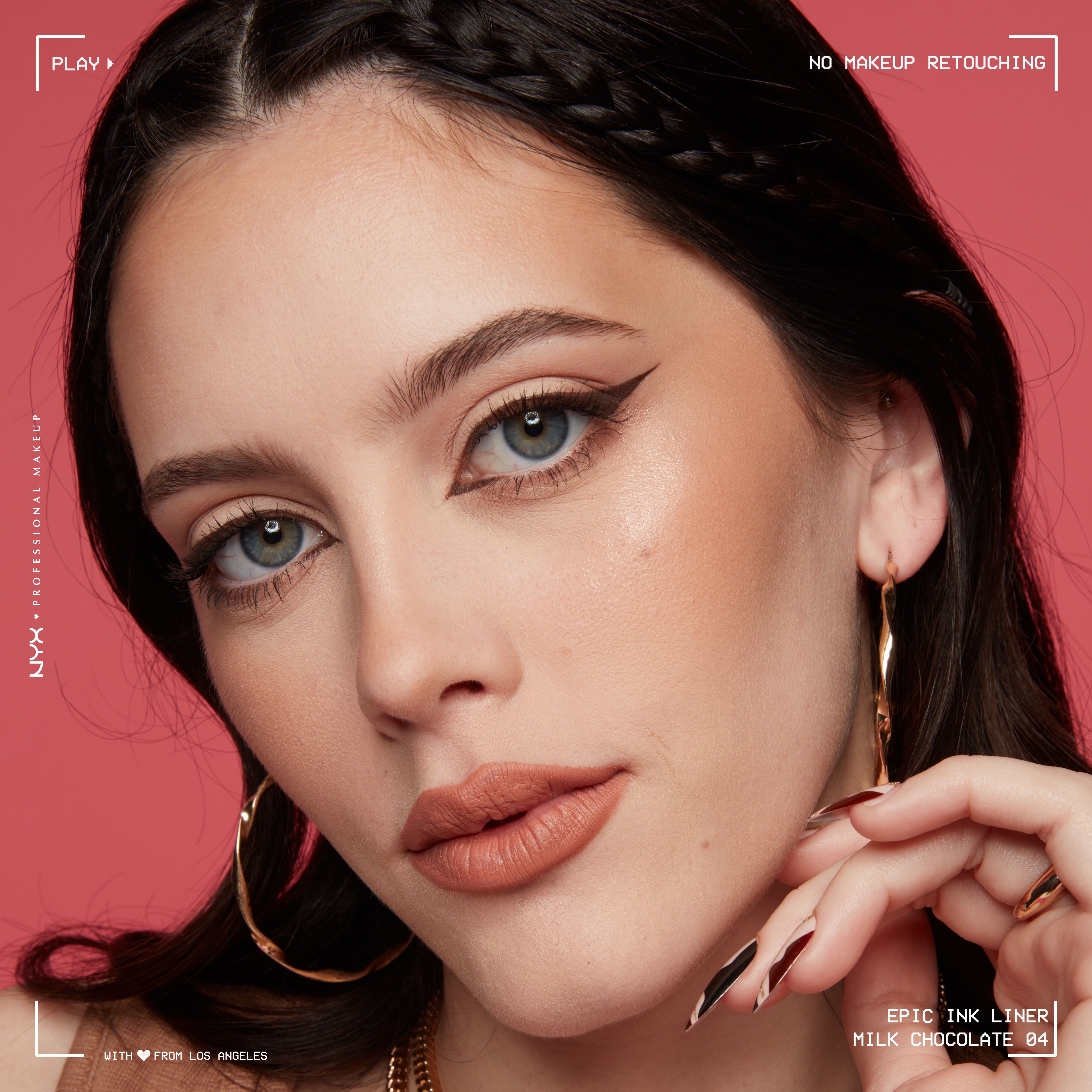 Model looking at the camera wearing Epic Liner in Milk Chocolate, in a cat eye eyeliner look
