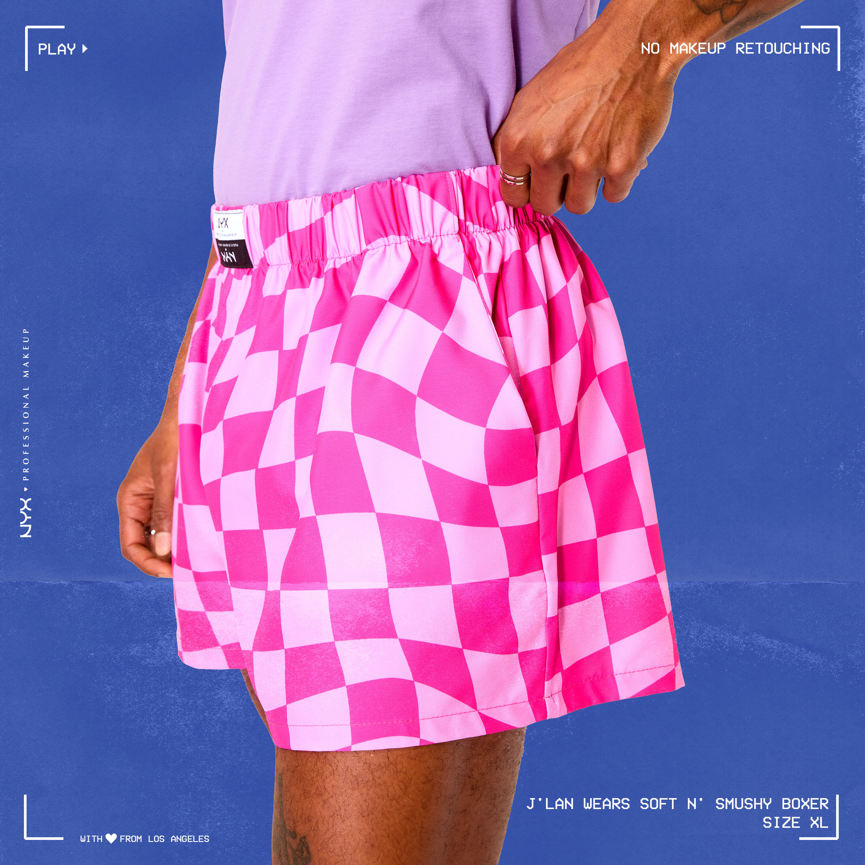 Model wearing Soft n' Smushy Pink Checker Print Boxers in a size extra large, standing slightly diagonally