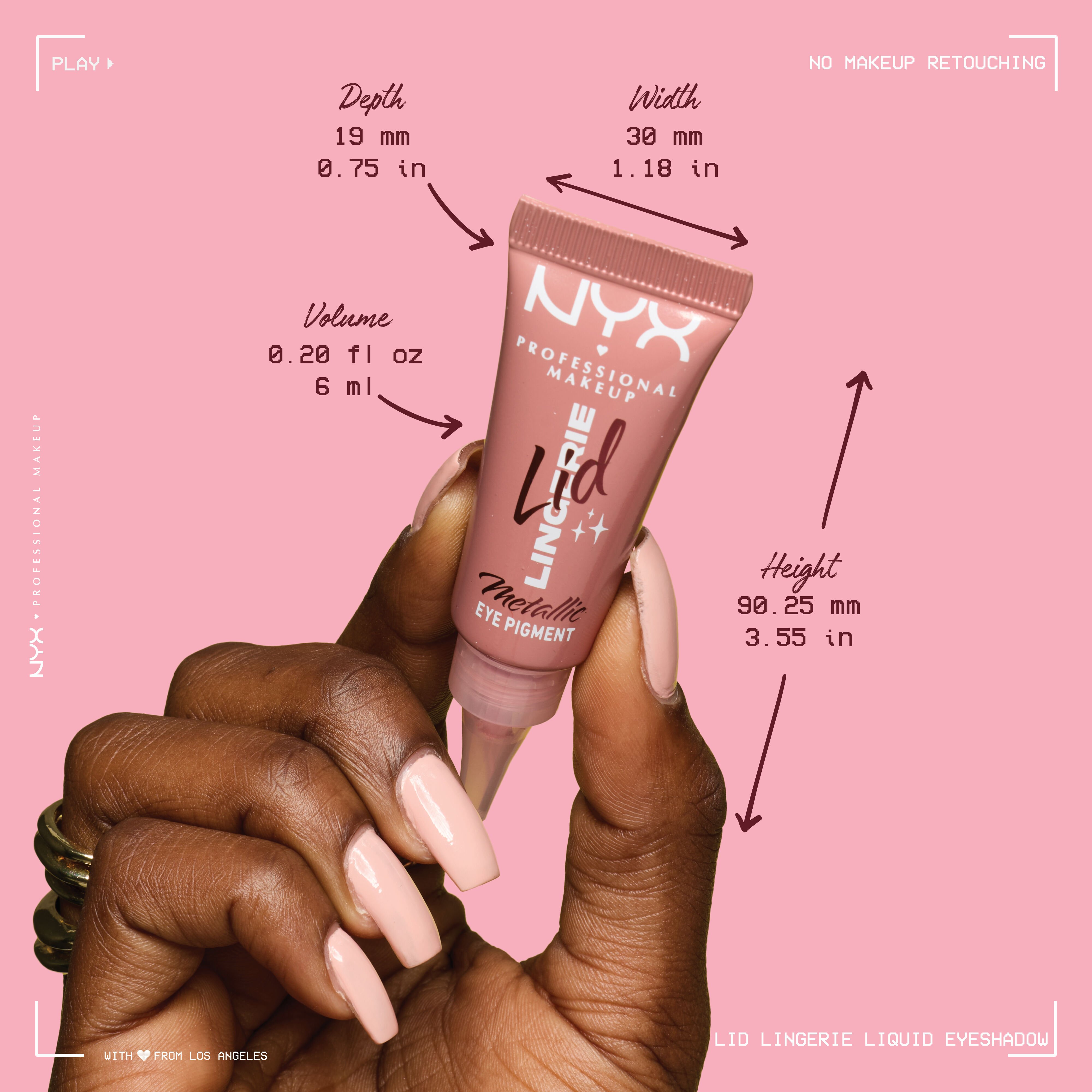 Hand holding a tube of NYX Professional Makeup Lid Lingerie Eye Pigment with the packaging dimensions labeled: Volume: 0.20 fl oz / 6 ml, Width: 30 mm/1.18 inches, Height: 90.25 mm/3.55 inches, and Depth: 19mm/0.75 inches.