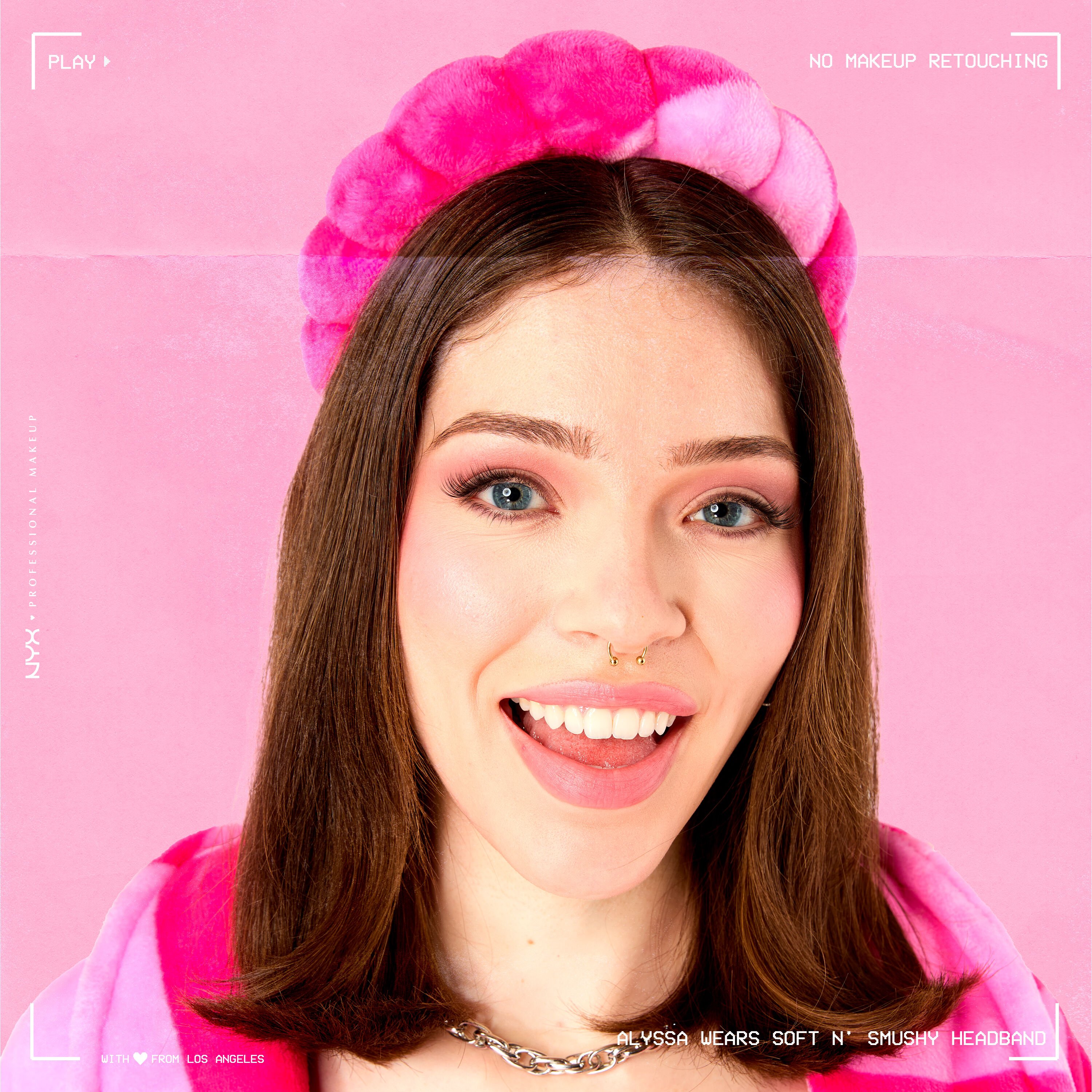 Model wearing Soft n' Smushy Pink Checker Print Bubble Hairband looking at the camera and smiling