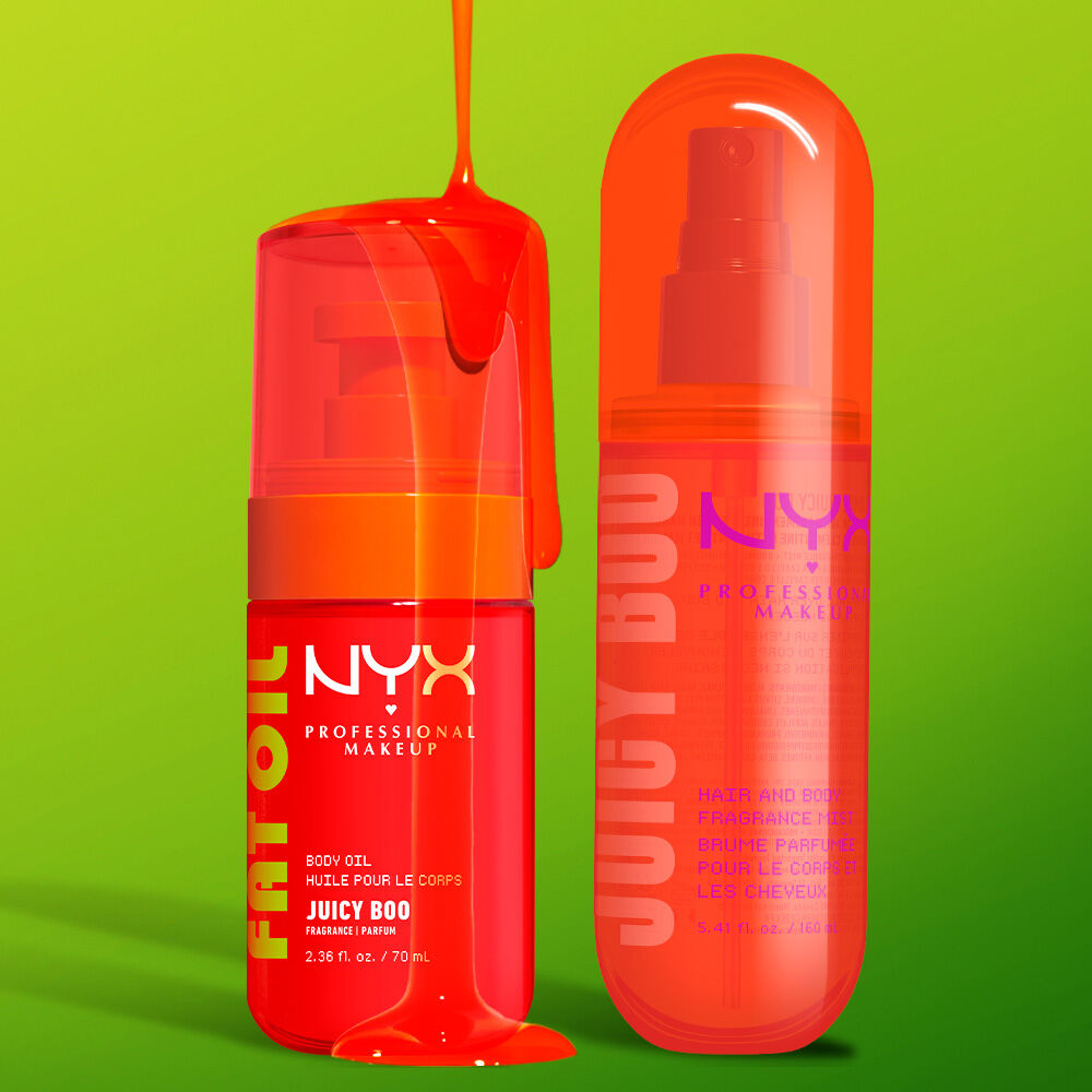 Two NYX Professional Makeup Juicy Boo products on a lime green background with glossy orange liquid: Fat Oil body oil in a bright orange pump bottle and hair & body fragrance mist in a coral spray bottle.