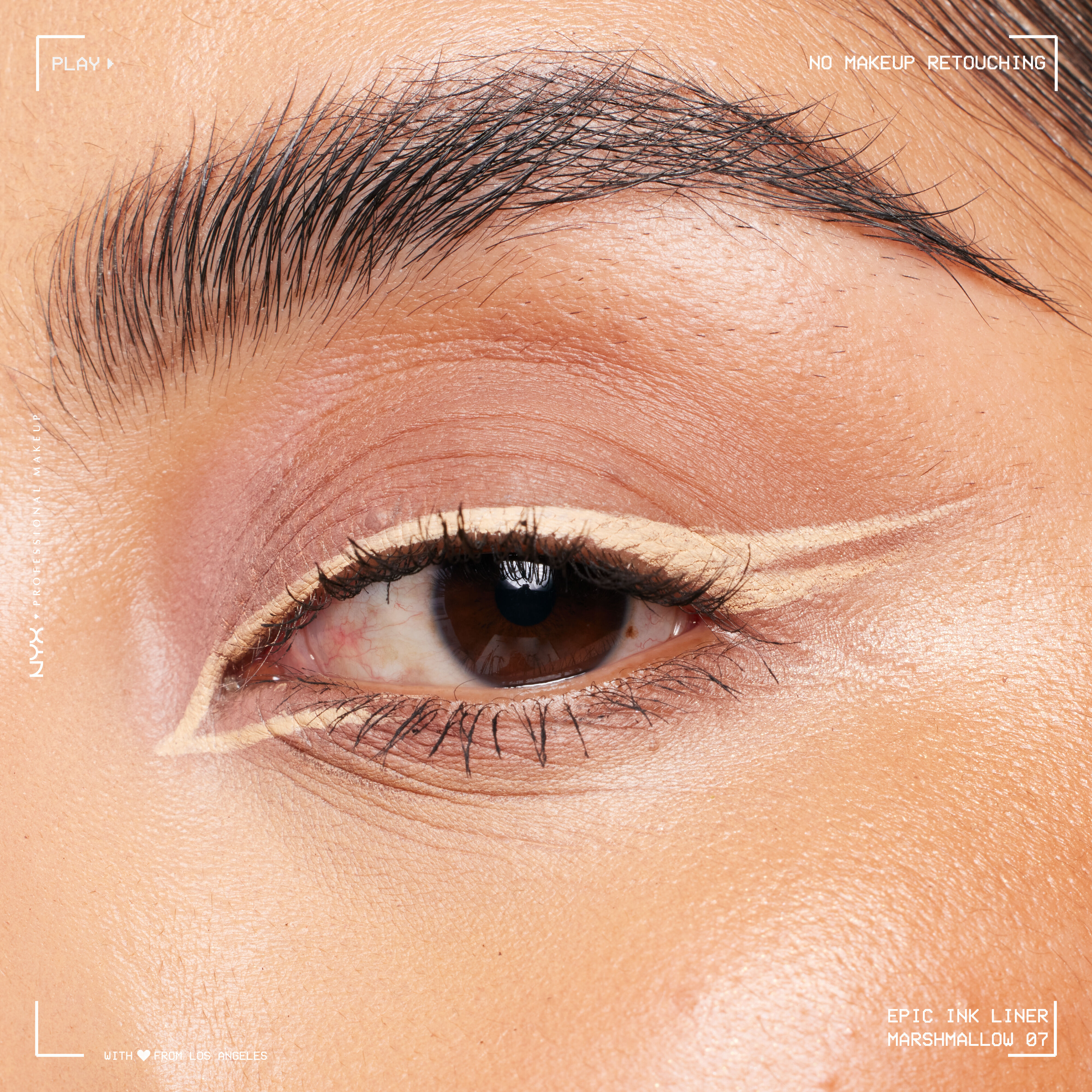 Close-up of an eye wearing Epic Ink Liquid Liner in Marshmallow, in a double wing eyeliner look with inner eye eyeliner