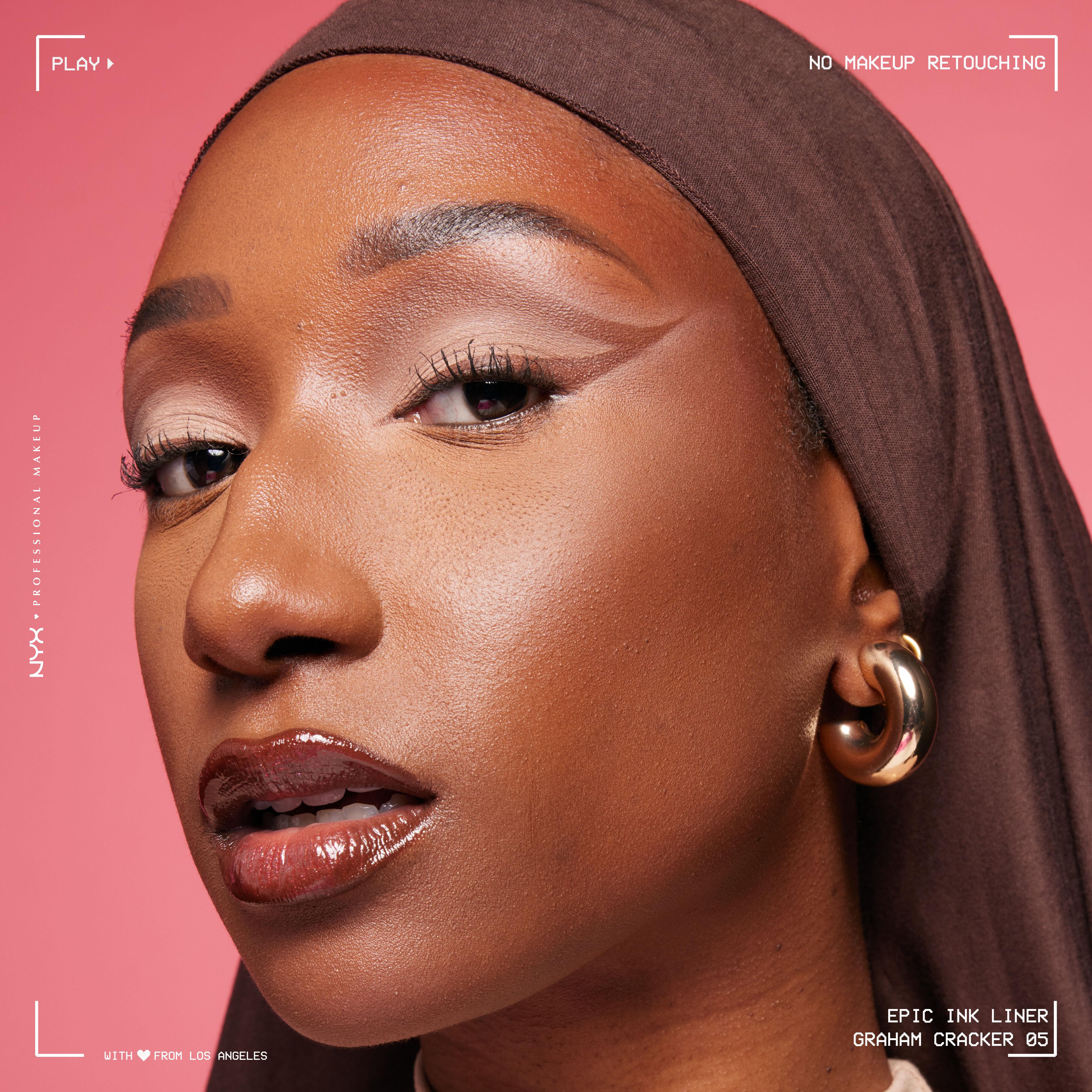 Model looking at the camera wearing Epic Liner in Graham Cracker, in a winged liner look connected to a floating crease