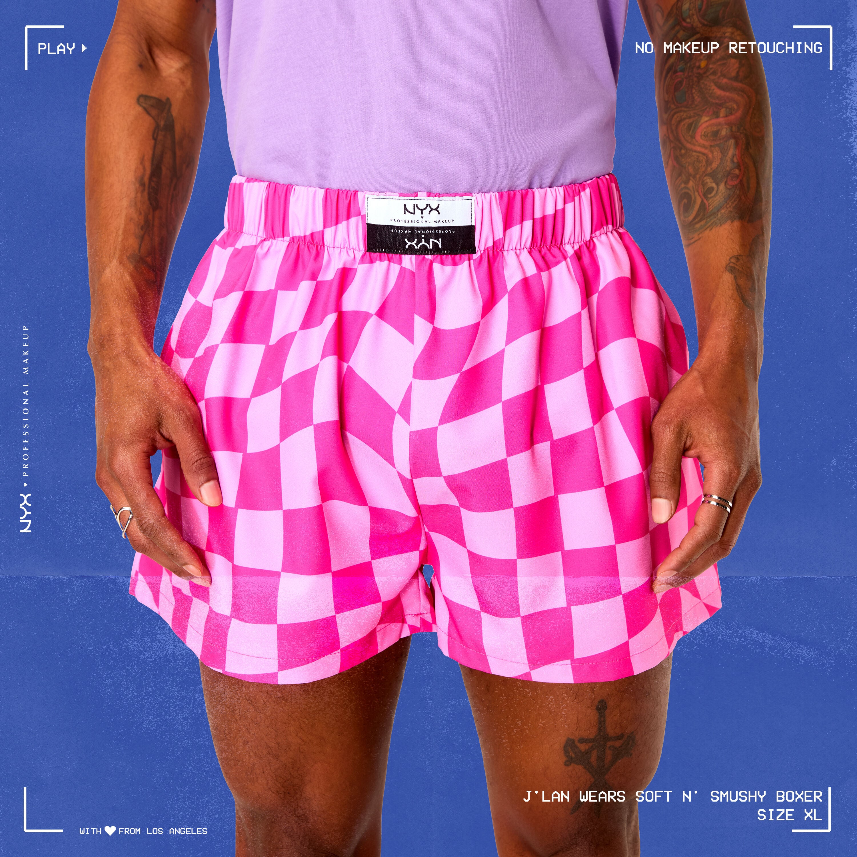 Model wearing Soft n' Smushy Pink Checker Print Boxers in a size extra large