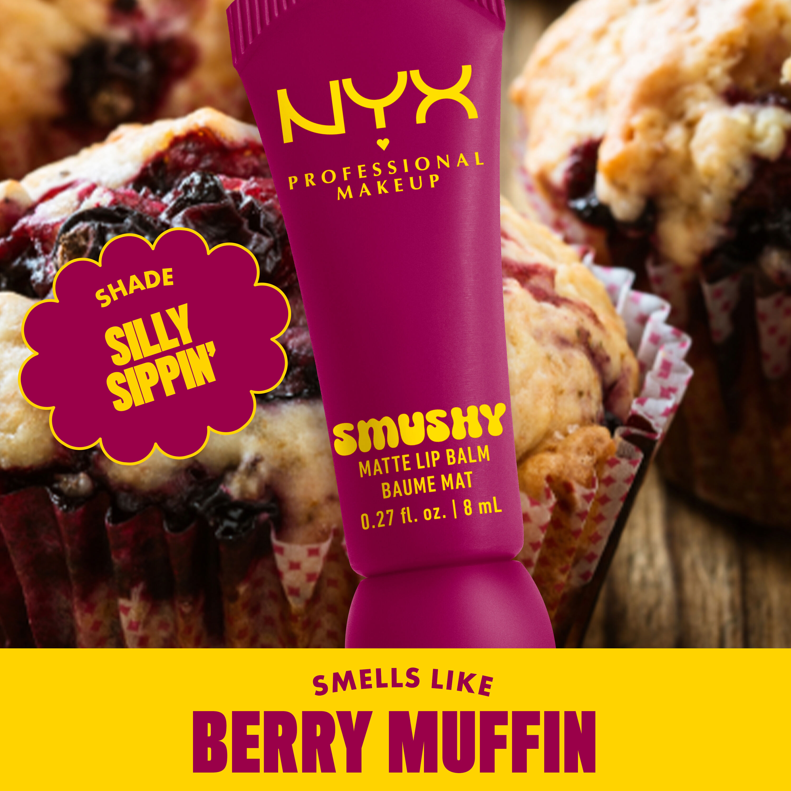Smushy Matte Lip Balm in deep purple shade, Silly Sippin', on background of muffins with text "smells like berry muffins