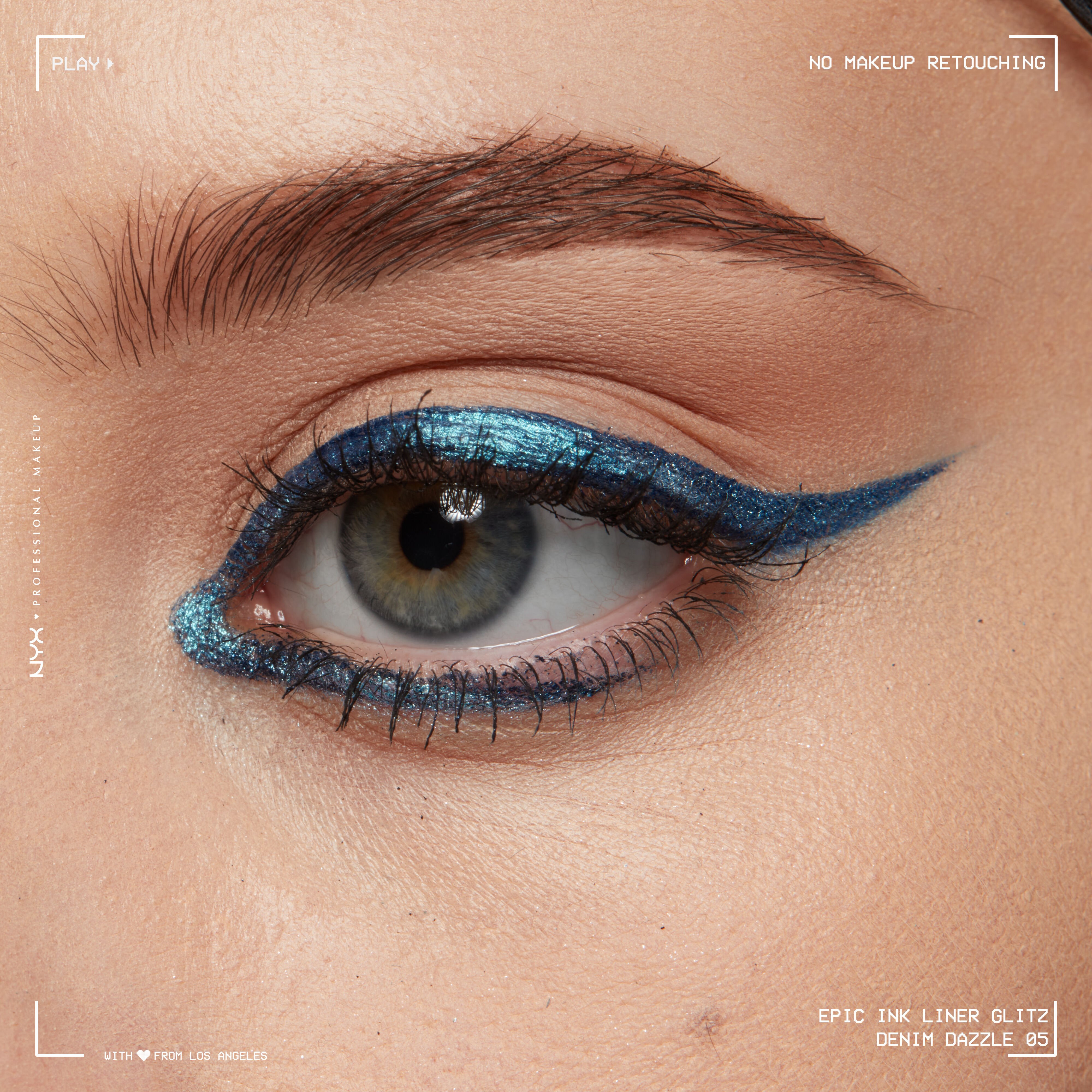 Close-up of an eye wearing Epic Ink Liquid Liner in Denim Dazzle, in a winged liner look with an inner corner detail