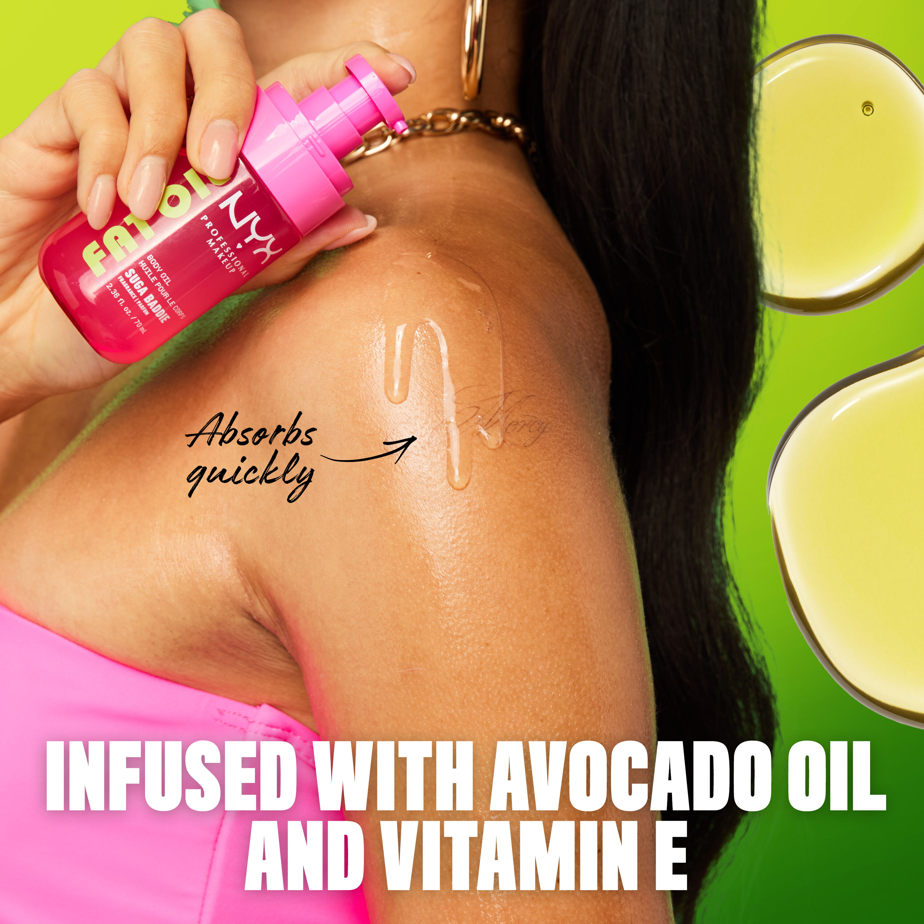 Infused with avocado oil & vitamin E - lifestyle shot of model applying Suga Baddie Body Oil.