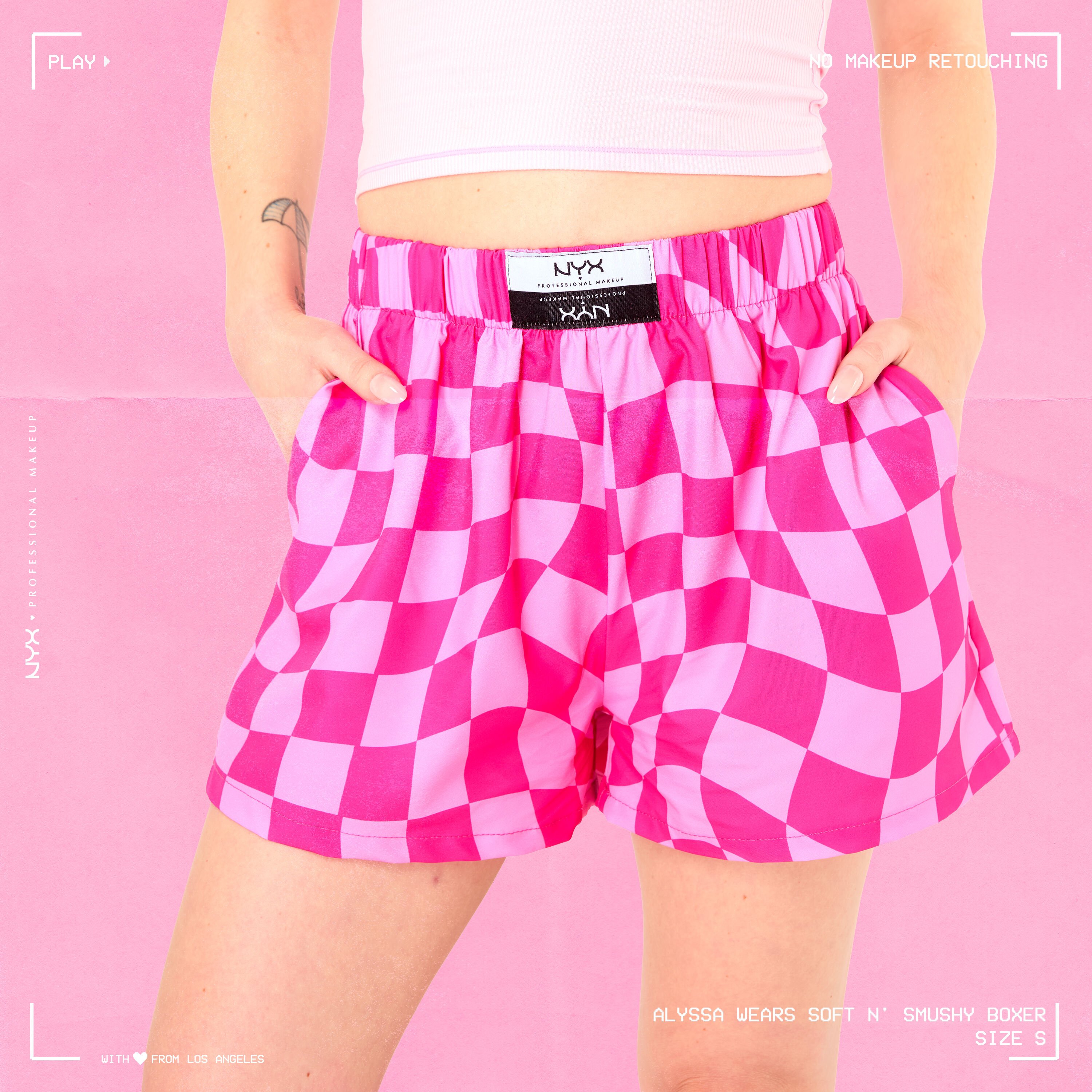 Model wearing Soft n' Smushy Pink Checker Print Boxers in a size small