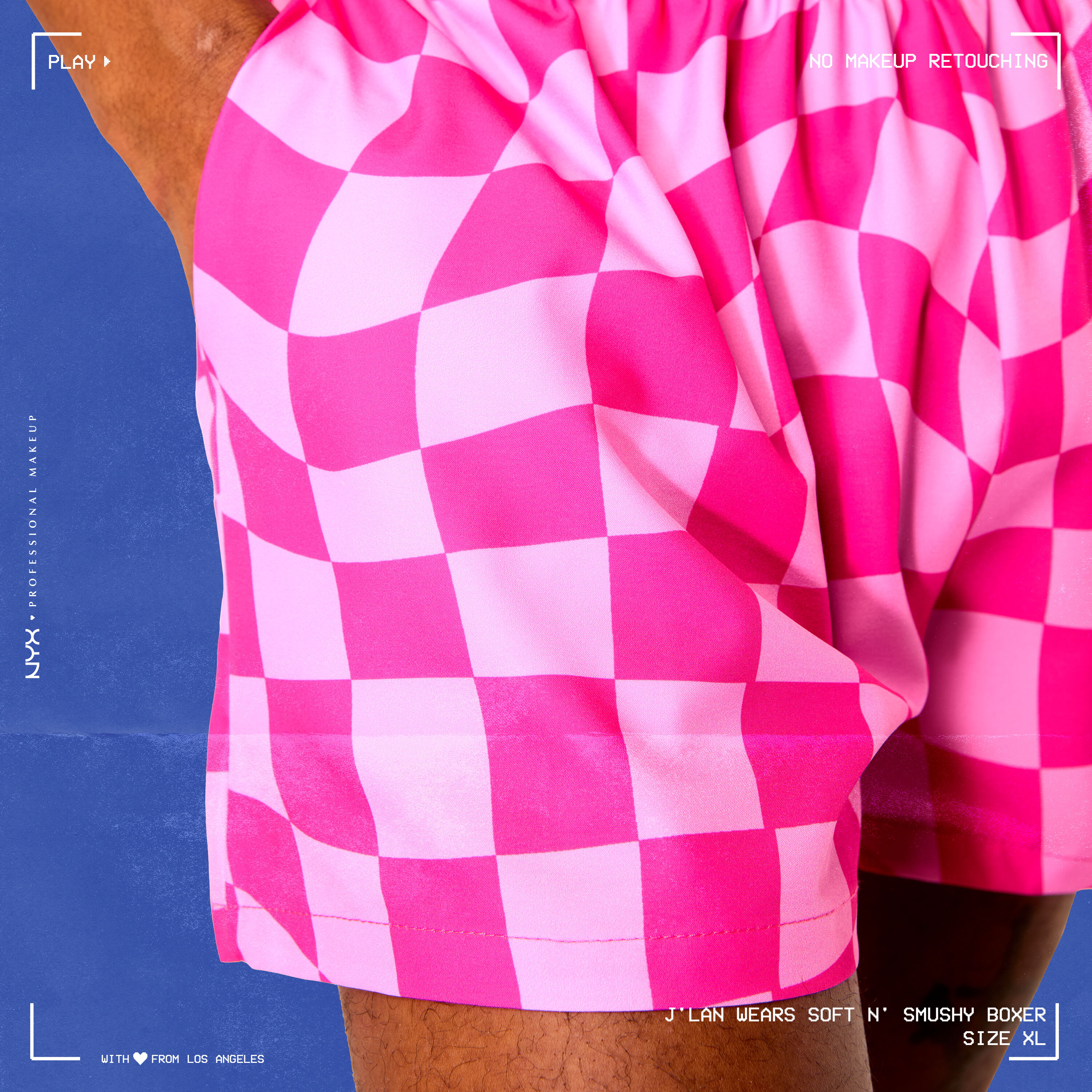 Close-up of model wearing Soft n' Smushy Pink Checker Print Boxers in a size extra large, with hand in boxer pocket