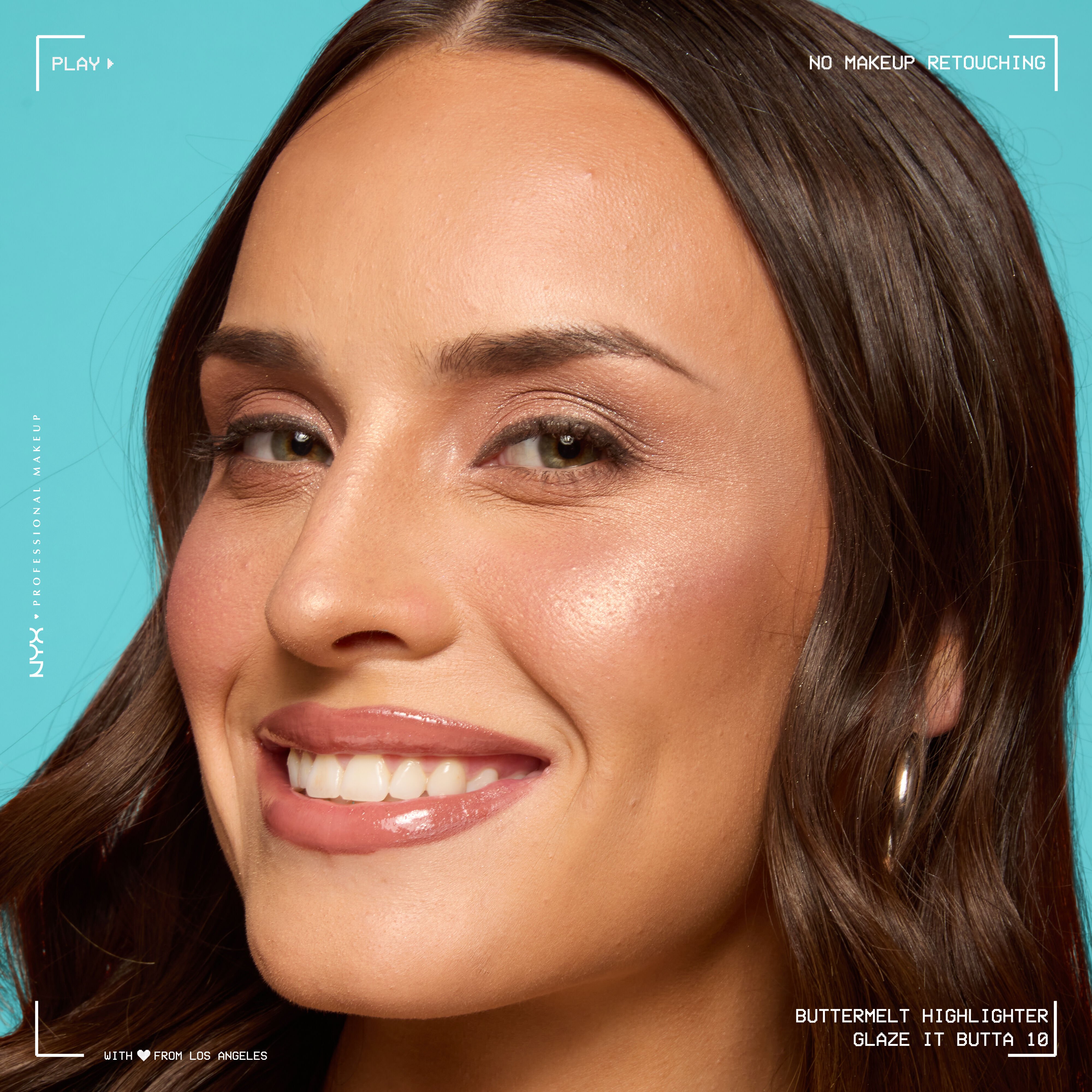 Model looking at the camera and smiling, wearing Buttermelt Highlighter in shade Glaze It Butta, a light bronze shade
