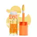 Duck Plump lip gloss bottle and applicator with duck cutout background