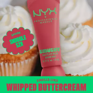 Smushy Matte Lip Balm in shade Snuggle Szn on background of cupcakes with text "smells like whipped buttercream"