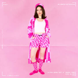 Model Alyssa wearing Soft n' Smushy headband, robe, boxers, and socks, posing, smiling, and looking at the camera