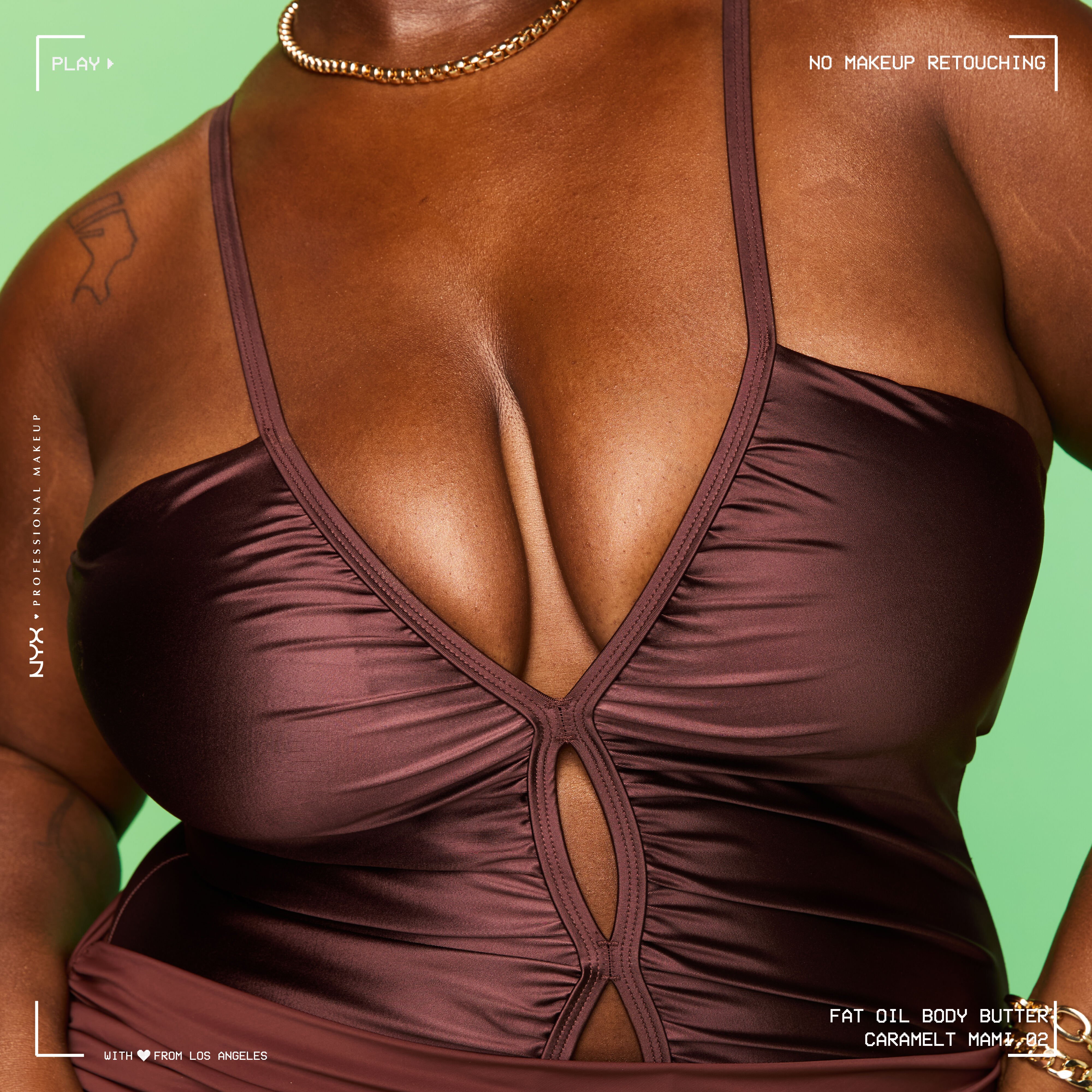 Close-up of model's chest showing golden shimmer glow from Caramelt Mami Body Butter on warm background