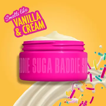 Open pink jar of Suga Baddie Body Butter with text: "Smells like vanilla & cream" on yellow/orange background with whipped cream and sprinkles. 