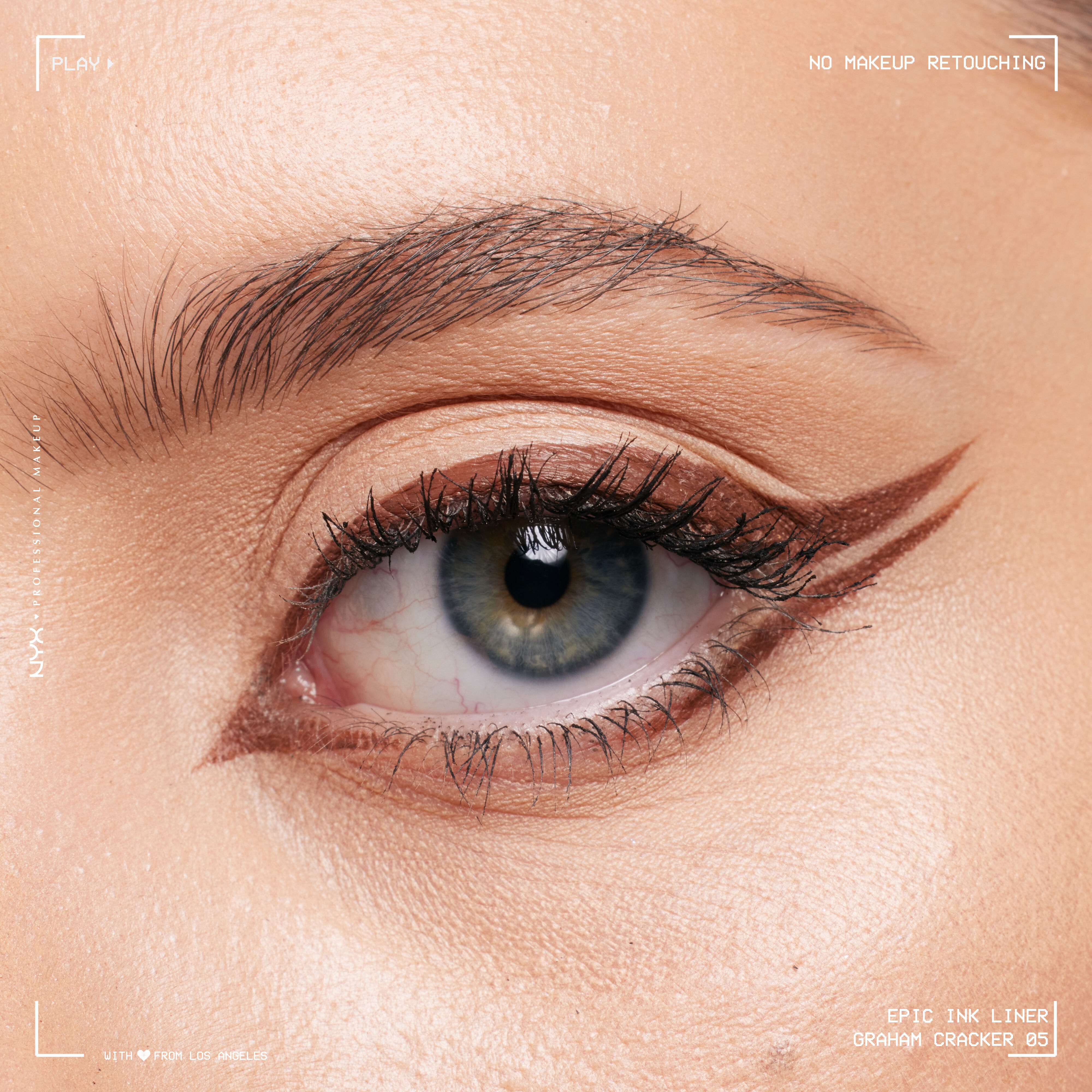 Close-up of an eye wearing Epic Ink Liquid Liner in Graham Cracker, in a double winged eyeliner look