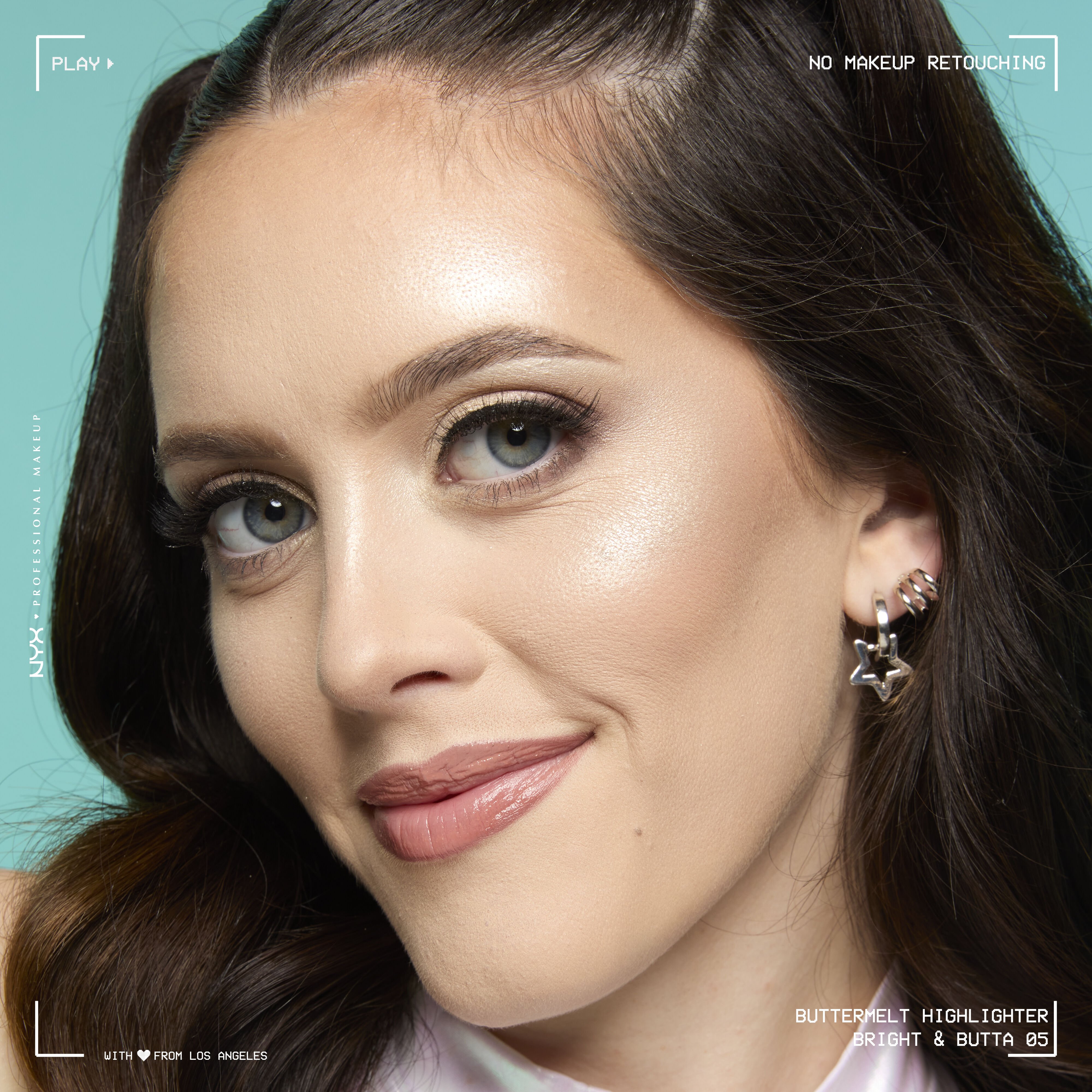 Model looking at the camera and smiling, wearing Buttermelt Highlighter in shade Bright & Butta, a light champagne shade