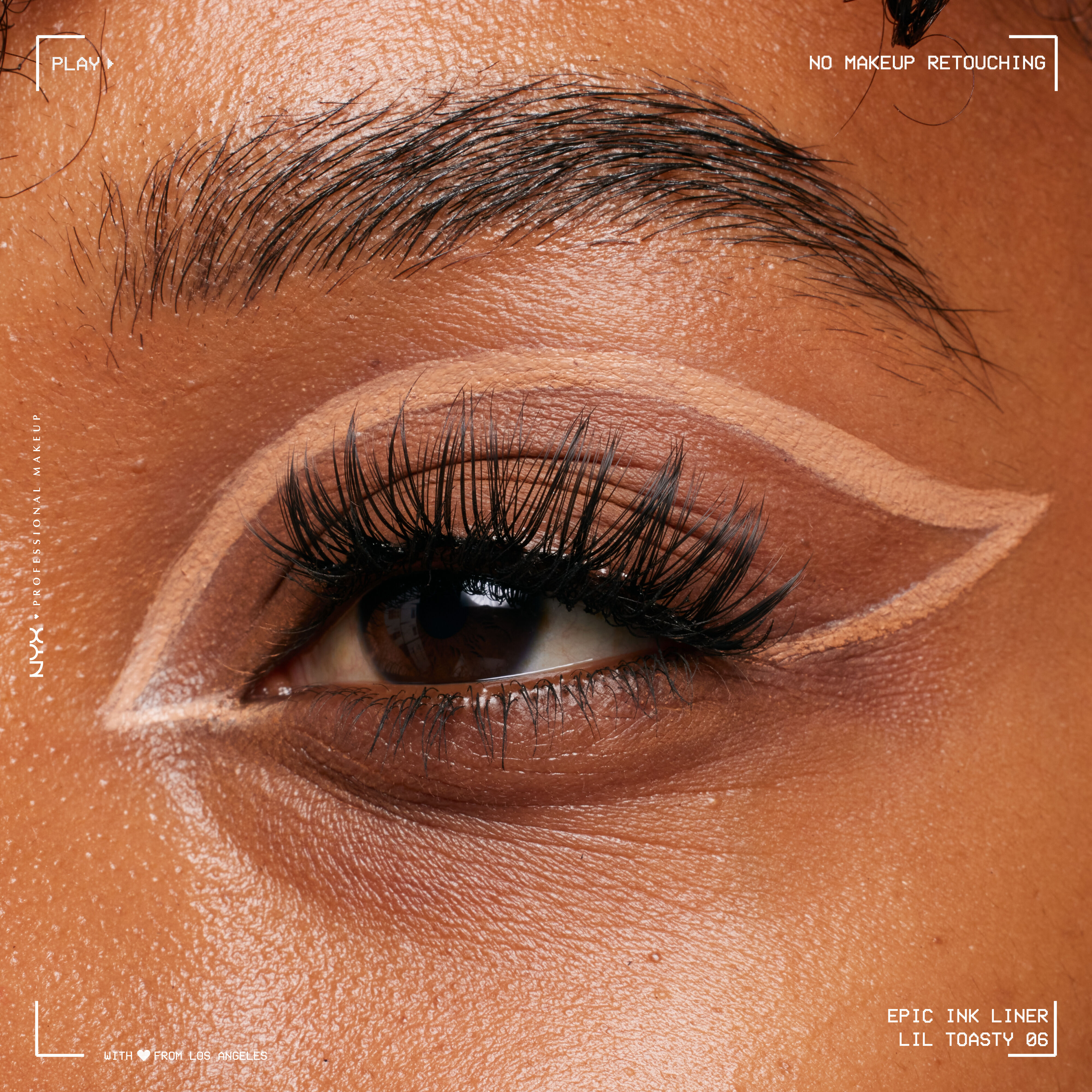 Close-up of eye wearing Epic Ink Liquid Liner in Lil Toasty, in a floating liner look