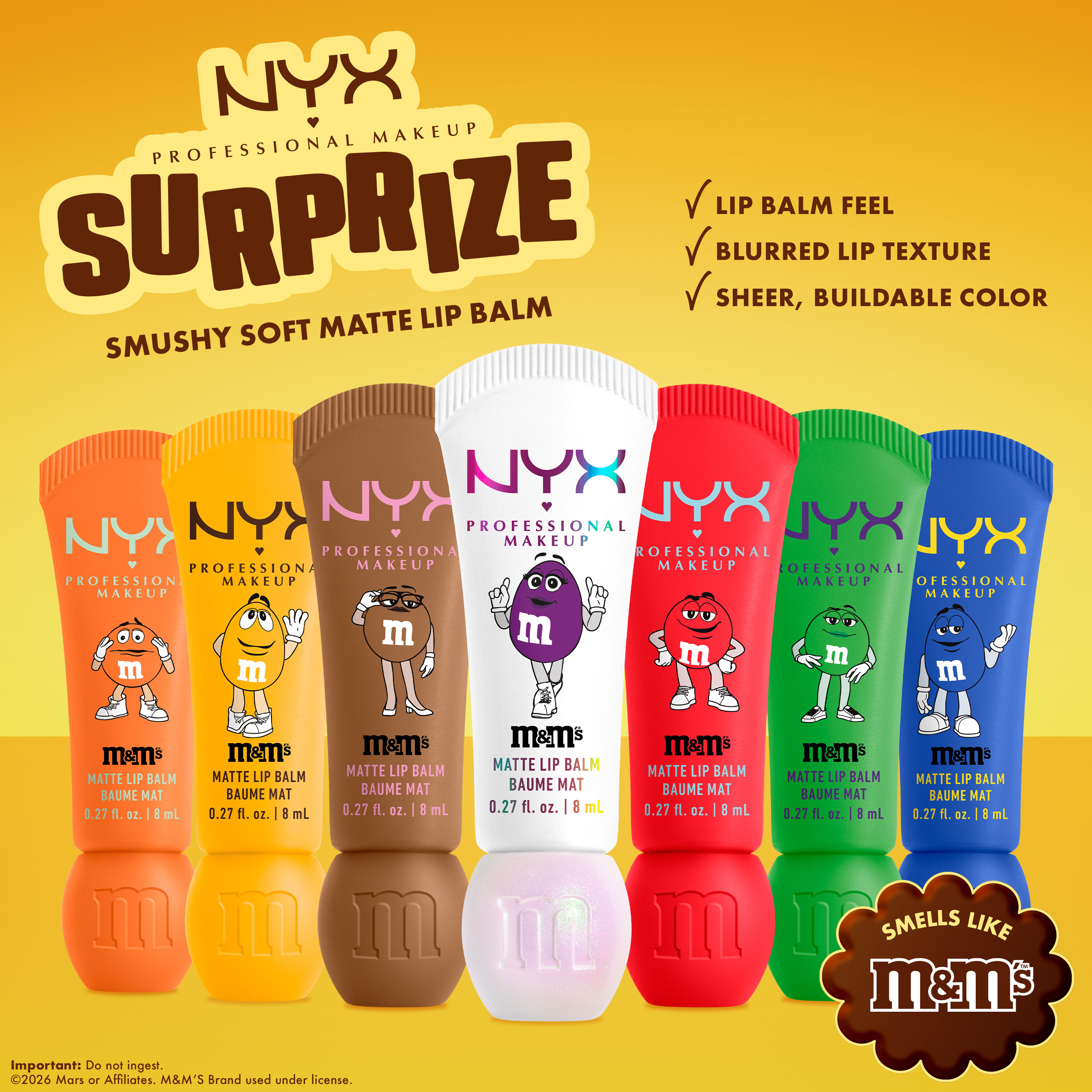 Seven NYX Professional Makeup M&M'S Smushy Soft Matte Lip Balm tubes in assorted colors on a yellow background with text noting lip balm feel, blurred lip texture, sheer buildable color, and M&M'S scent.