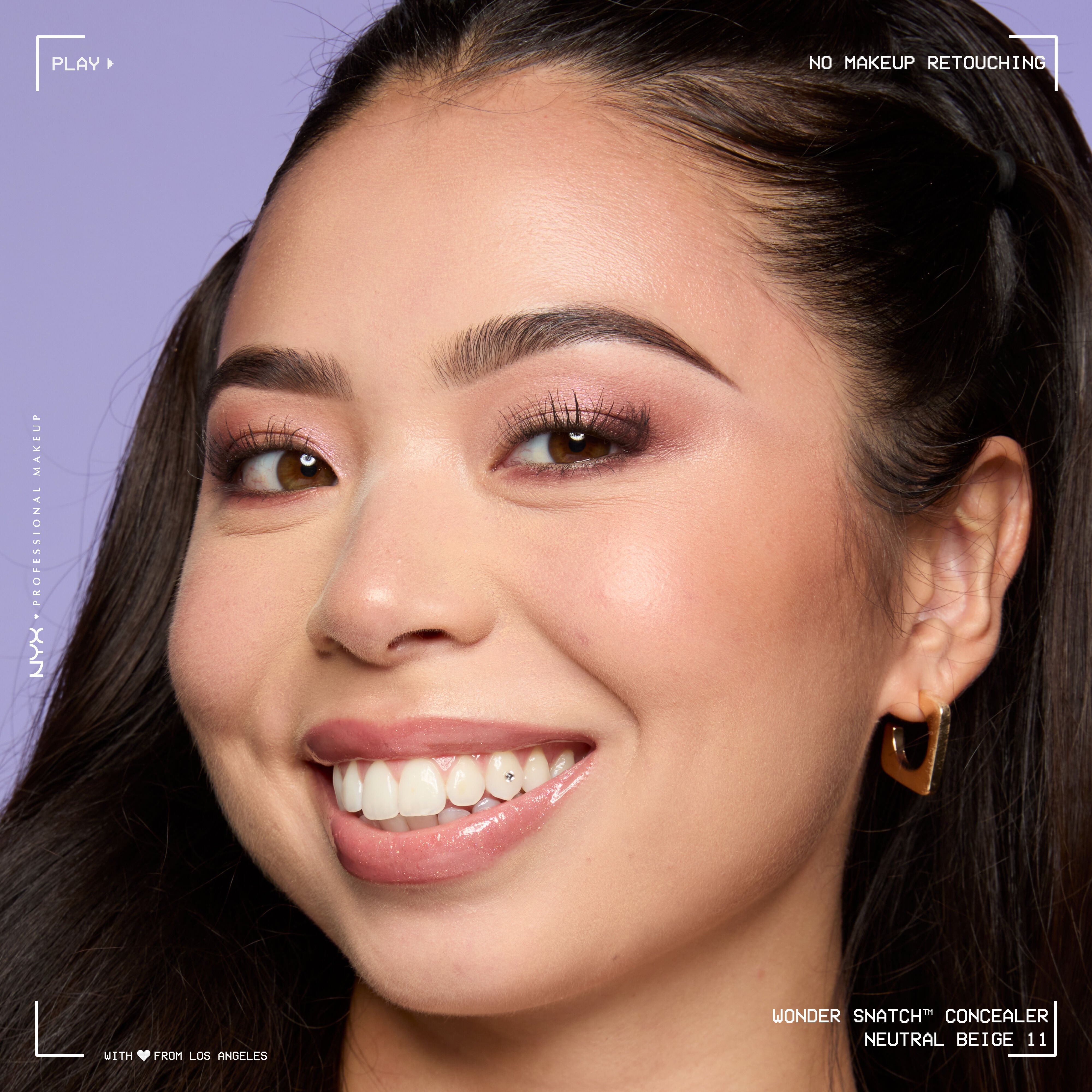 Close-up of model wearing Wonder Snatch(TM) Concealer, with brightened under-eyes, smooth-looking skin, and a natural finish.