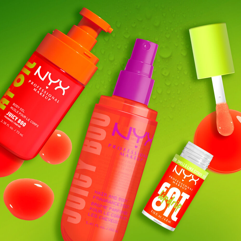 Three NYX Professional Makeup Juicy Boo products on a lime green background with glossy orange and clear bubbles: Fat Oil body oil, hair & body fragrance mist, and Fat Oil Lip Drip with applicator wand.