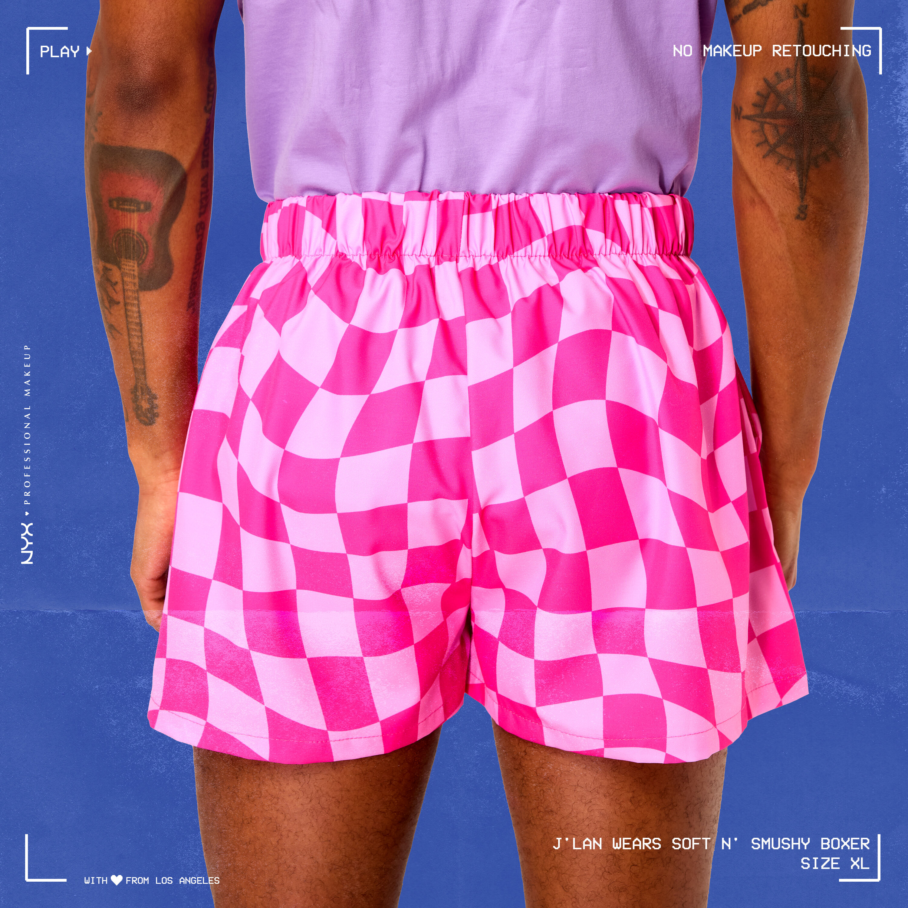 Model wearing Soft n' Smushy Pink Checker Print Boxers in a size extra large, showing the back of the boxers