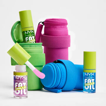 3 Lip Gloss Pouches and Fat Oil Lip Drip Chillz Lip Oils with one poking out of the green pouch