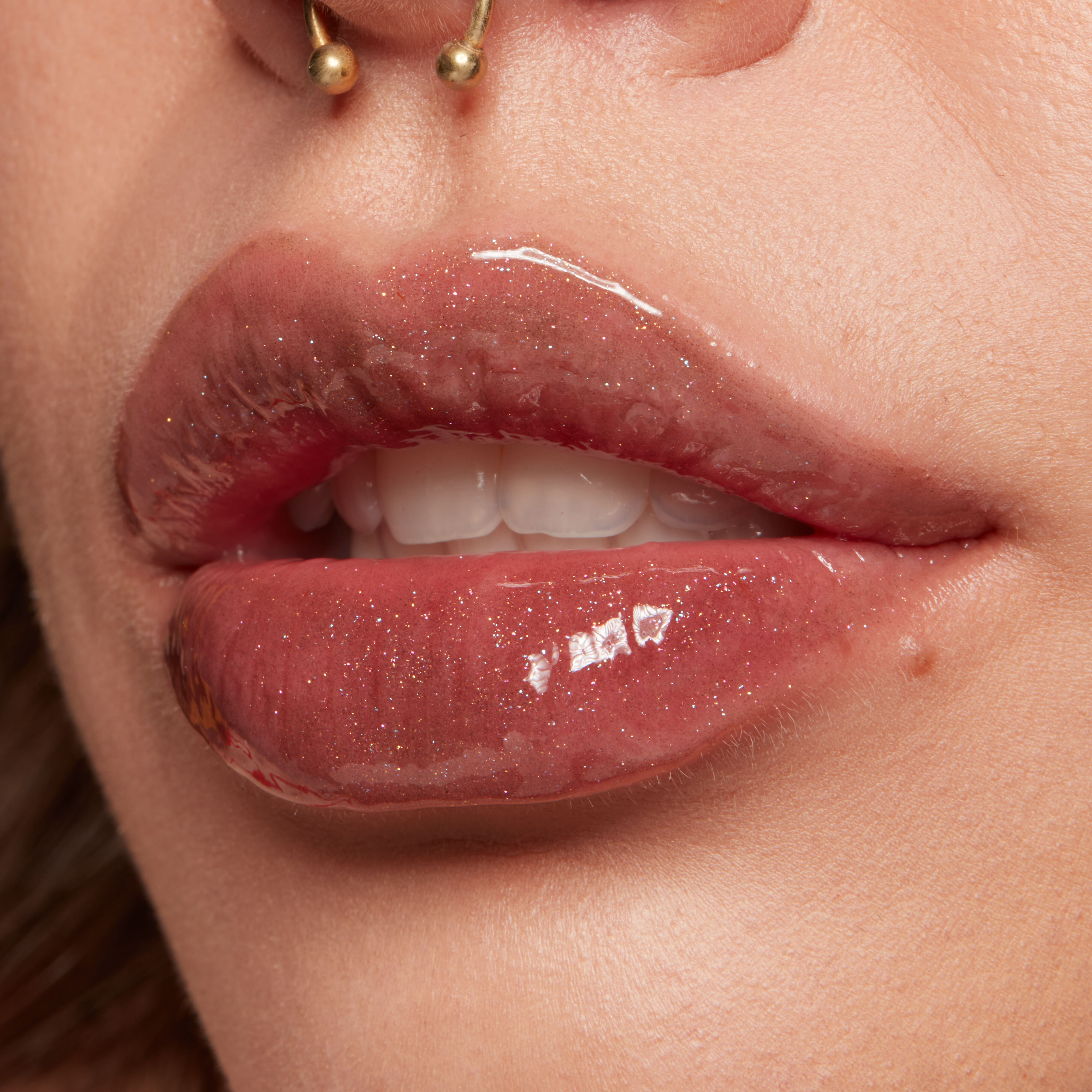 Duck Plump Lip Plumping Gloss on closeup side view of lips