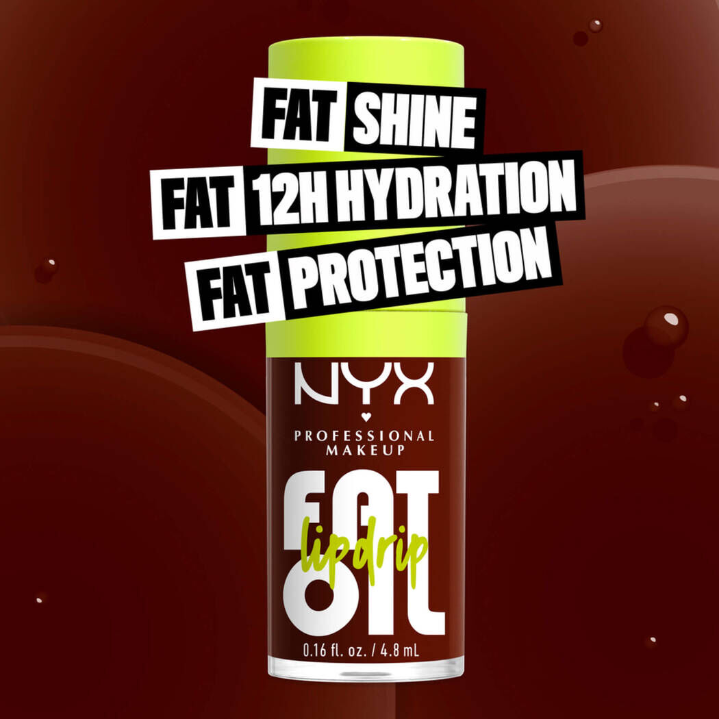 Fat Oil Lip Drip Lip Oil in shade Status Update bottle. Fat Shine. Fat 12H Hydration. Fat Protection.