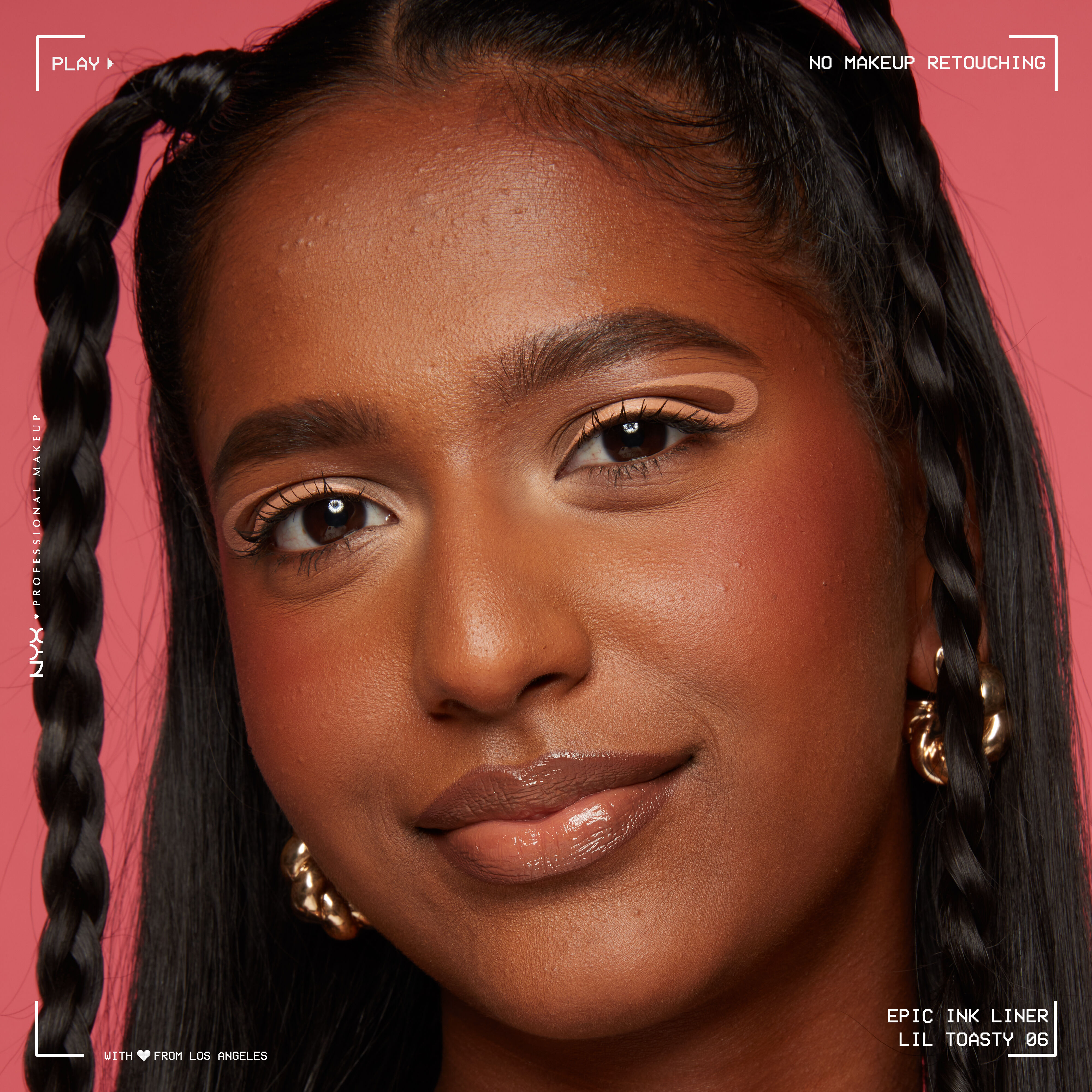 Model looking at the camera wearing Epic Liner in Lil Toasty, in a wavy graphic liner look