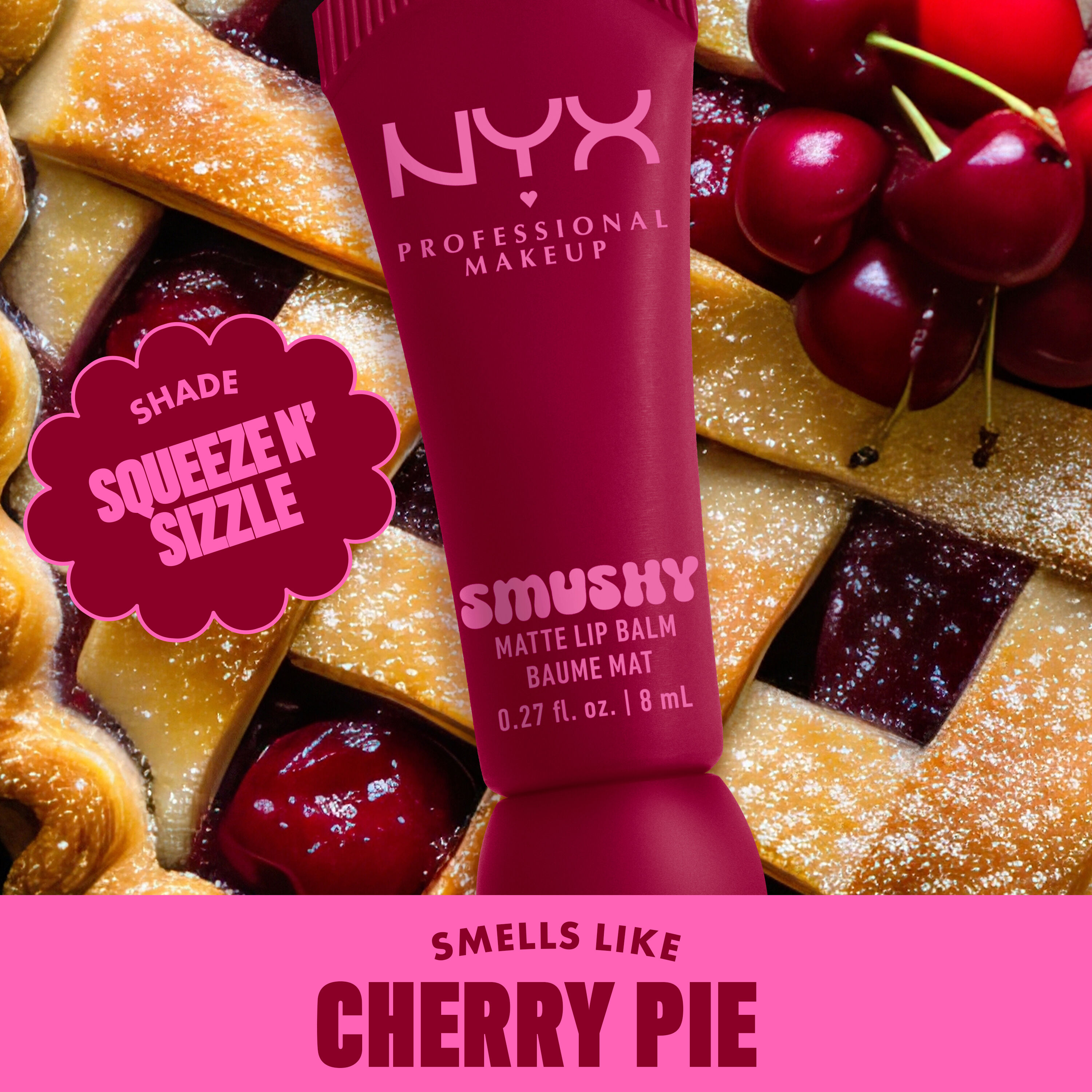 Smushy Matte Lip Balm in cherry red shade, Squeeze N Sizzle, on cherry pie background with text "smells like cherry pie"