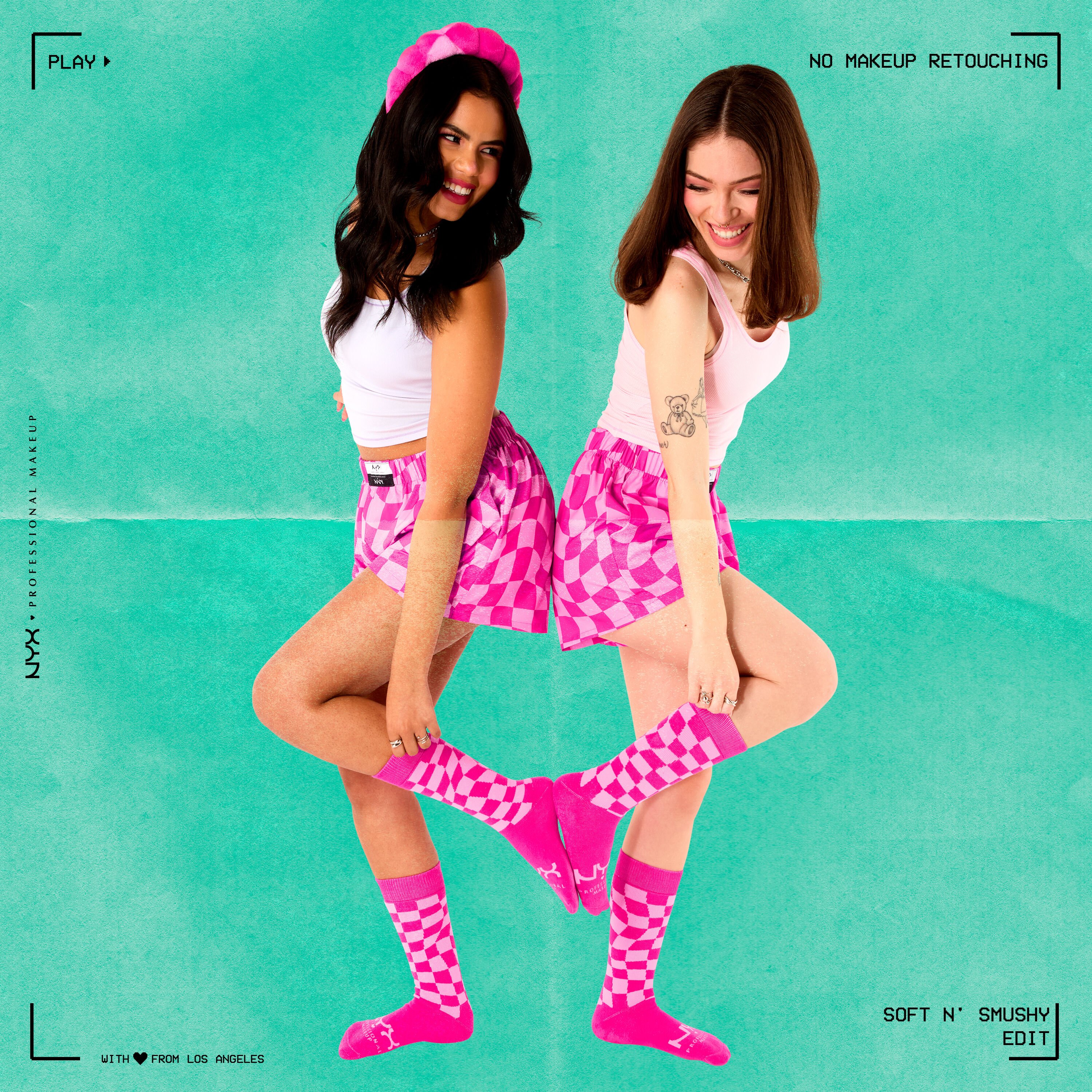 2 models standing back to back wearing Soft n' Smushy merch, including boxers, socks, and a headband