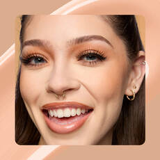 Close-up of model wearing Wonder Snatch(TM) Concealer in Shade 07 Light Ivory.