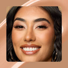 Close-up of model wearing Wonder Snatch(TM) Concealer in Shade 14 Medium Olive.