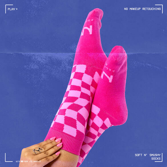 Ribbed and woven limited-edition pink checker print socks.