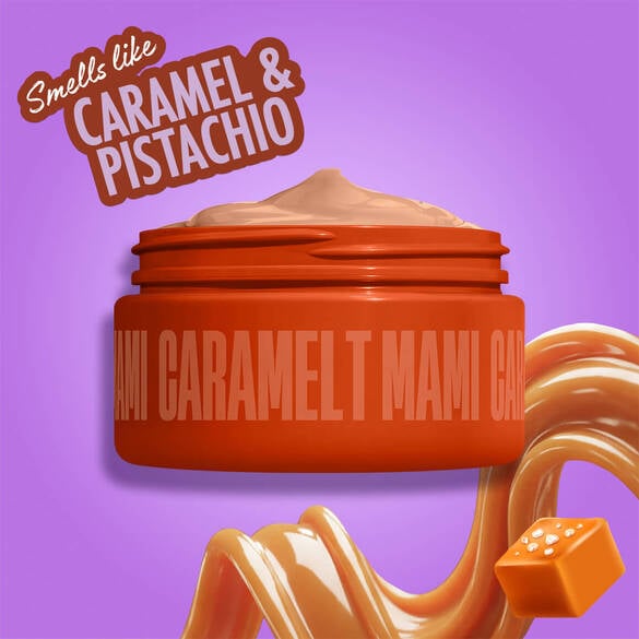 NYX Professional Makeup Caramelt Mami body cream in an orange jar, with caramel swirl and caramel candy, labeled as smelling like caramel and pistachio, on a purple background.