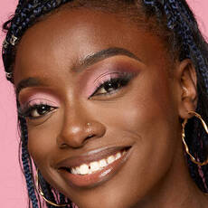 Model wearing NYX Make’em Wonder™ Foundation in shade 41 Warm Walnut with soft glow and pink shimmer eyeshadow.