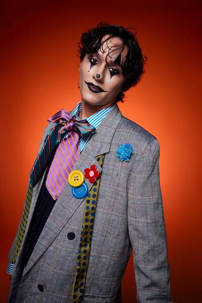 Werewolf Halloween makeup look, with model wearing half face makeup look, with fur detailing & fangs