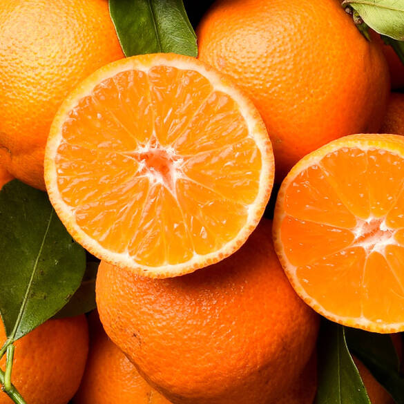 Close-up of juicy clementines to represent one of the top notes of Juicy Boo fragrance.