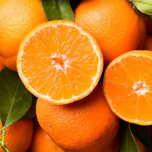 Close-up of juicy clementines to represent one of the top notes of Juicy Boo fragrance.