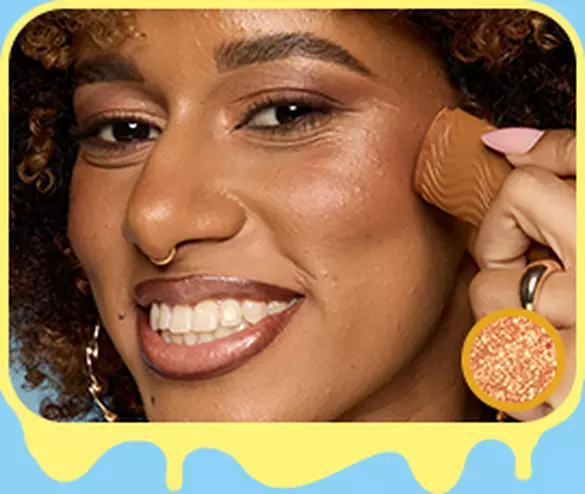 Model applying NYX Buttermelt Stix in Melt You Later 11 to cheekbone for warm bronzed glow