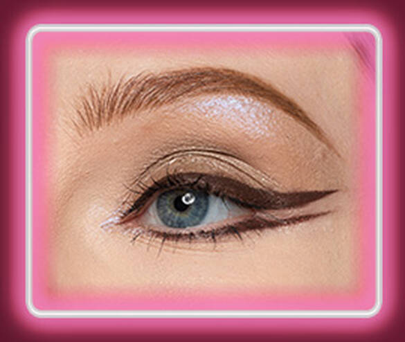 Step 4 of the Lid Lingerie eye look: 06 Mocha Mesh matte espresso cream eyeshadow drawn into a graphic winged liner along the lash line of a fair-skinned eye.