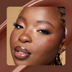 Close-up of model wearing Wonder Snatch(TM) Concealer in Shade 28 Deep Walnut.