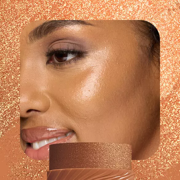 Model with warm bronze highlight wearing NYX Buttermelt Stix in Melt You Later 11 showing golden buttery glow