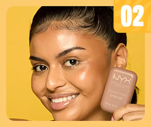 woman smiling and holding Buttermelt Bronzer
