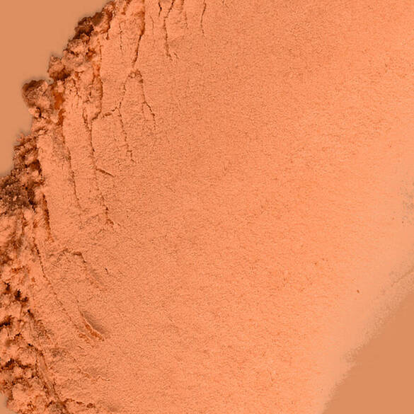 Texture swatch of Wonder Snatch™ Setting Powder in shade Sassy Spice, a translucent medium-deep shade