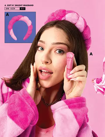 A pink and white headband labeled "Soft N' Smushy Headband" with a price of $12, displayed on a pink background.
