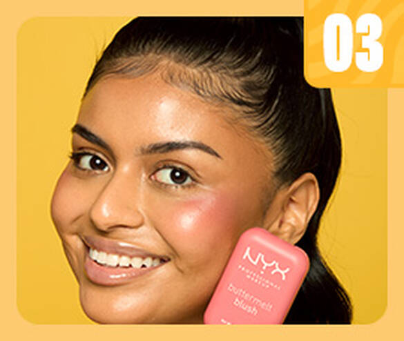 woman smiling and holding Buttermelt Blush]