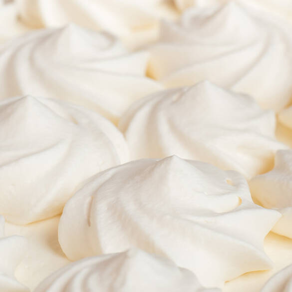 Close-up shot of whipped cream to represent one of the top notes in Suga Baddie fragrance.