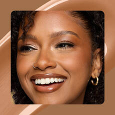 Close-up of model wearing Wonder Snatch(TM) Concealer in Shade 17 Cinnamon.